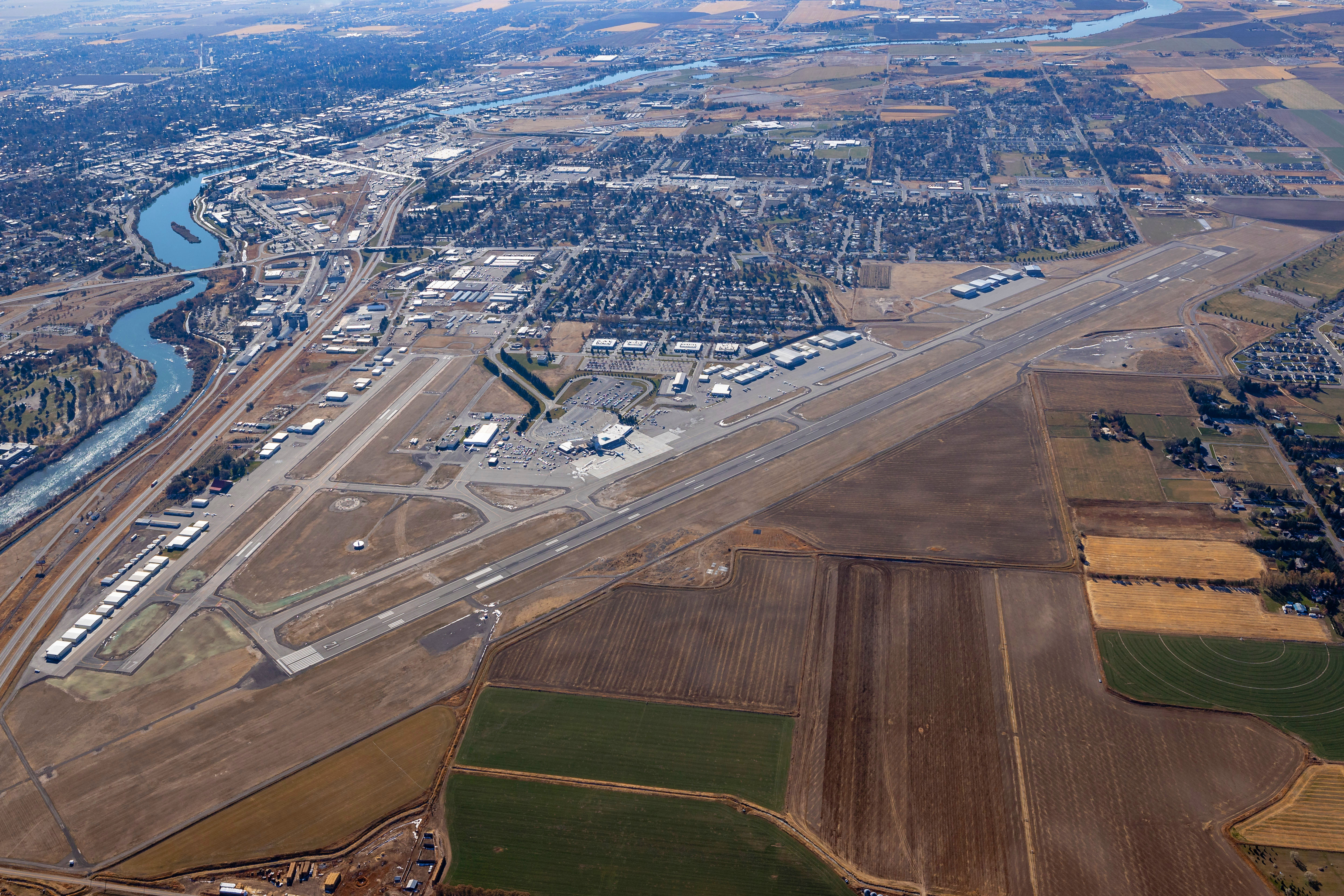 Aerial view of the airport grounds and runways facing south.